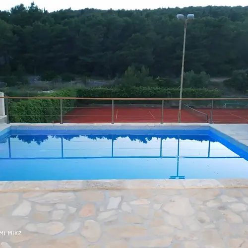 Tennis court and outdoor pool