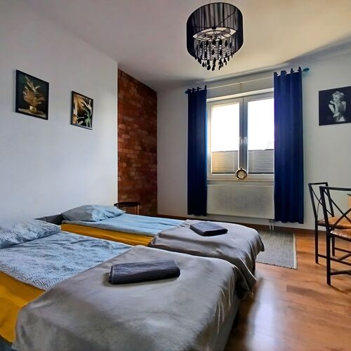 Przestronny Apartament z Trzema Sypialniami Centrum Torunia