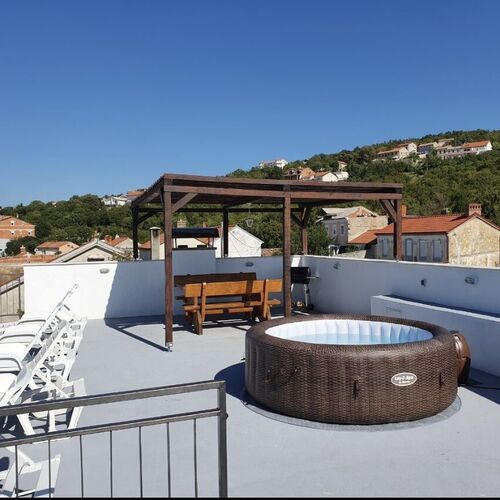 roof terrace with Jacuzzi, sunbeds, sitting area, barbecue
