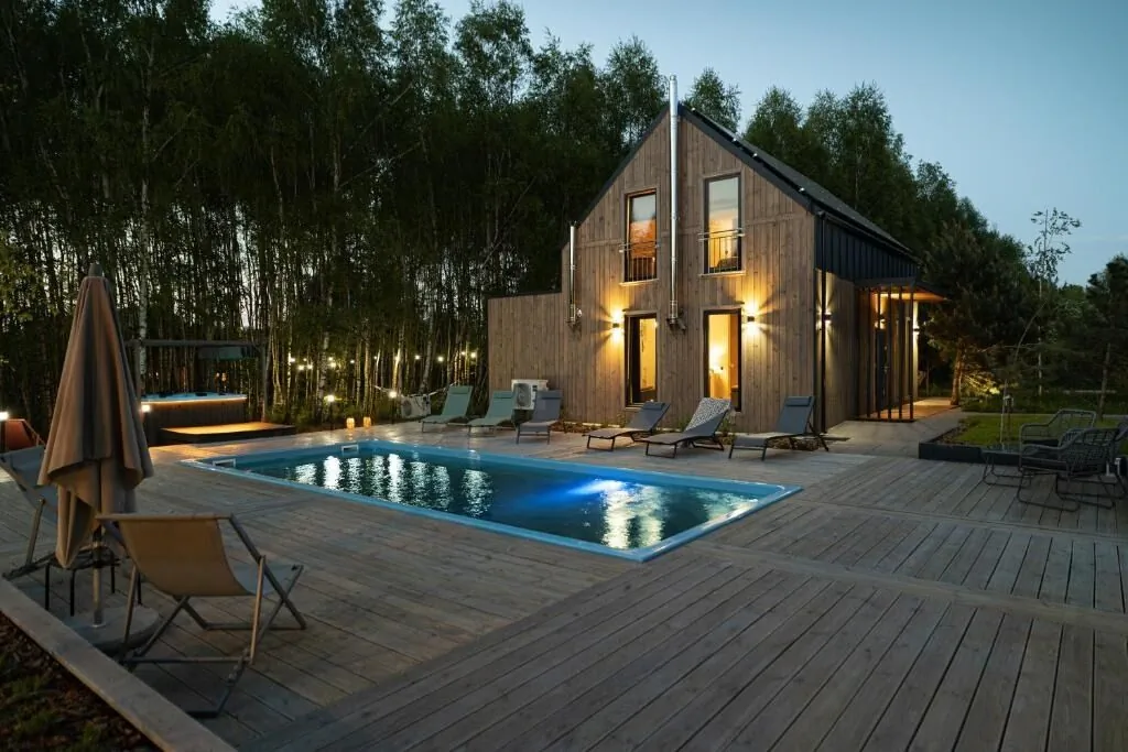 Między Brzozami / Domy w lesie