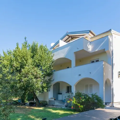 house with balconies close to the beach