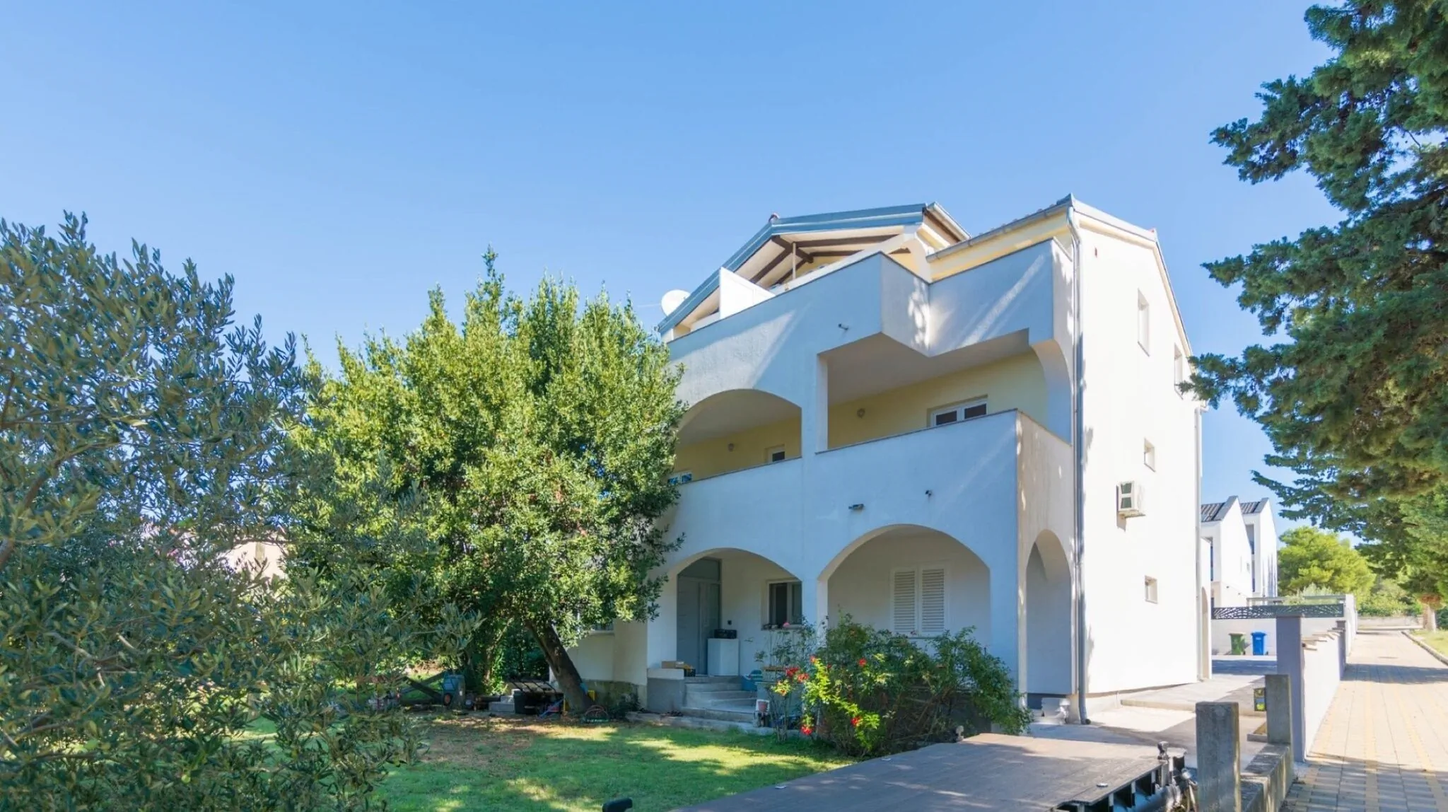house with balconies close to the beach