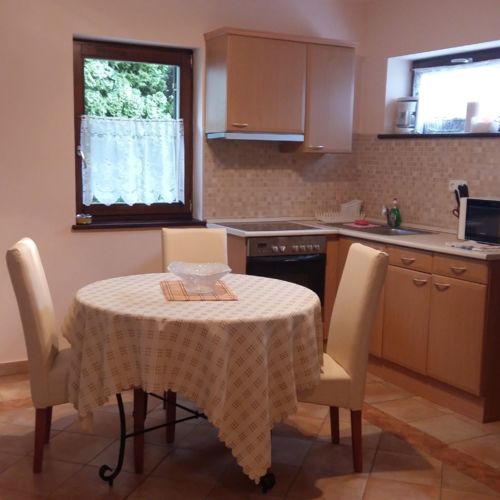 Apartament 2-osobowy na parterze z balkonem z 1 pomieszczeniem sypialnianym