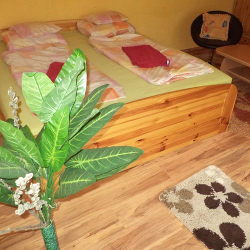 Apartament 4-osobowy na parterze z widokiem na ogród z 2 pomieszczeniami sypialnianymi (możliwa dostawka)