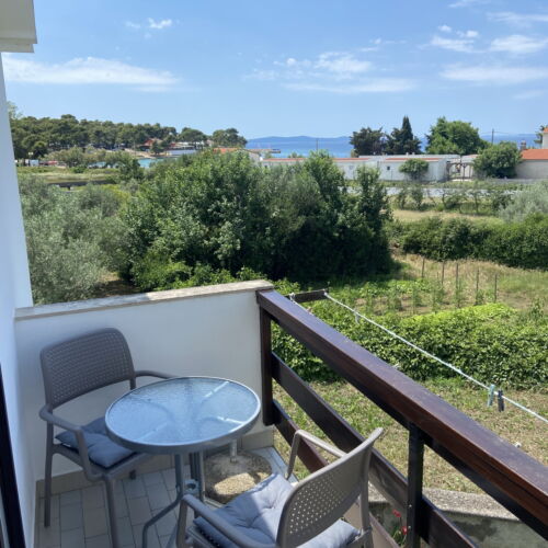 Studio Rekreační dům (jako celek) s manželskou postelí s výhledem částečně na moře