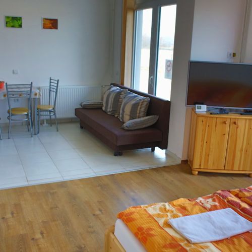 Apartament 2-osobowy na parterze z tarasem z 1 pomieszczeniem sypialnianym (możliwa dostawka)