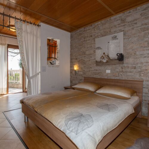 Bungalow (jako celek) s manželskou postelí s částečným výhledem na moře 