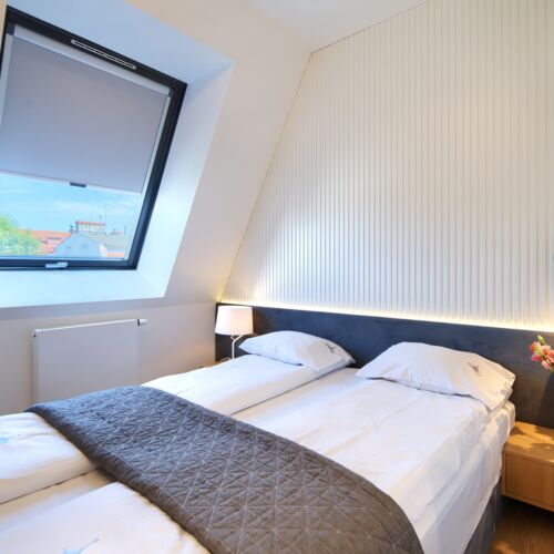 Apartament 4-osobowy na piętrze z balkonem z 2 pomieszczeniami sypialnianymi