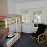 Double room with separate beds and shared bathroom