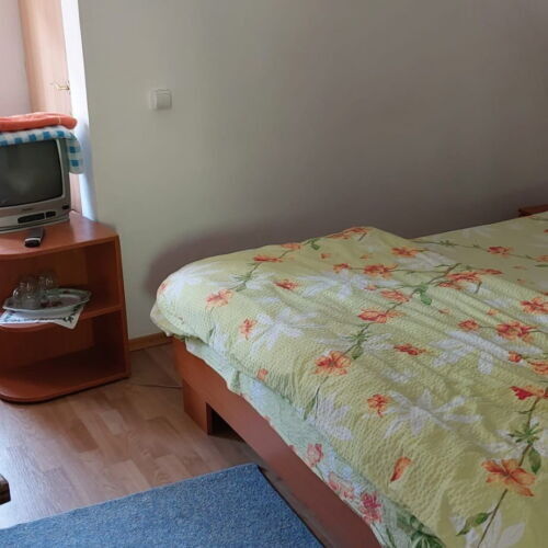 Camera tripla la mansardă cu balcon