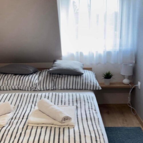 Camera dubla la mansardă cu aer condiționat