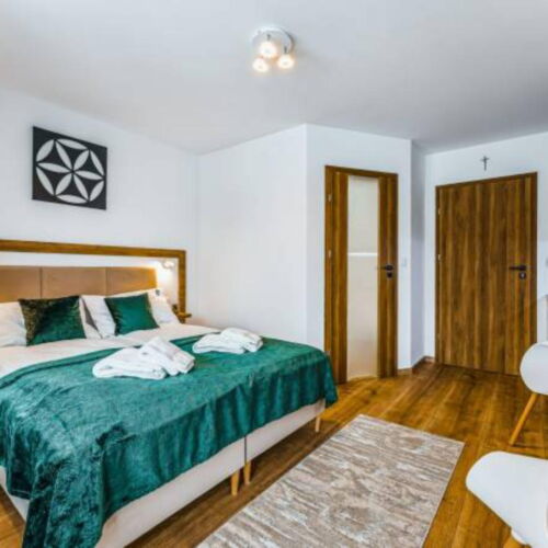 Apartament 2-osobowy z balkonem z aneksem kuchennym z 1 pomieszczeniem sypialnianym