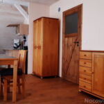 Dreibettzimmer mit Eigner Küche und Panorama auf den See