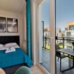 Apartament 4-osobowy z balkonem z 1 pomieszczeniem sypialnianym