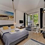 Apartament 4-osobowy z tarasem z 1 pomieszczeniem sypialnianym