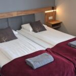 Apartament 2-osobowy z balkonem z aneksem kuchennym z 1 pomieszczeniem sypialnianym