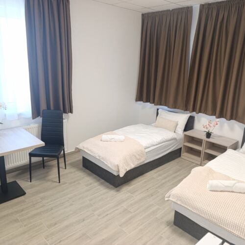 Se společnou kuchyňkou  Pokoj pro 4 os.