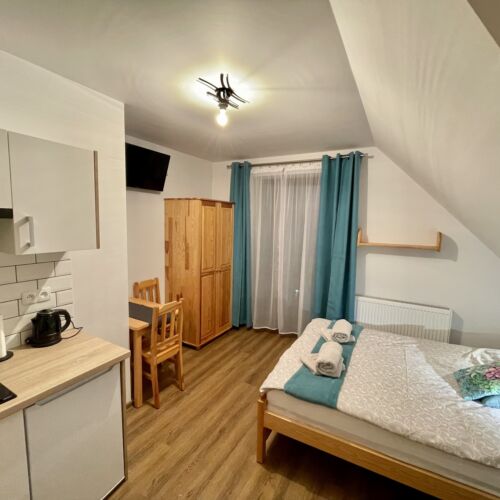 Apartament 2-osobowy z łazienką z aneksem kuchennym z 1 pomieszczeniem sypialnianym